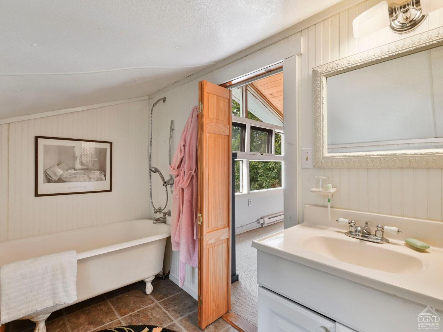 157 Horseshoe Road Conesville, NY 12076 - Photo 21 of 48 a bathroom with a tub sink and mirror