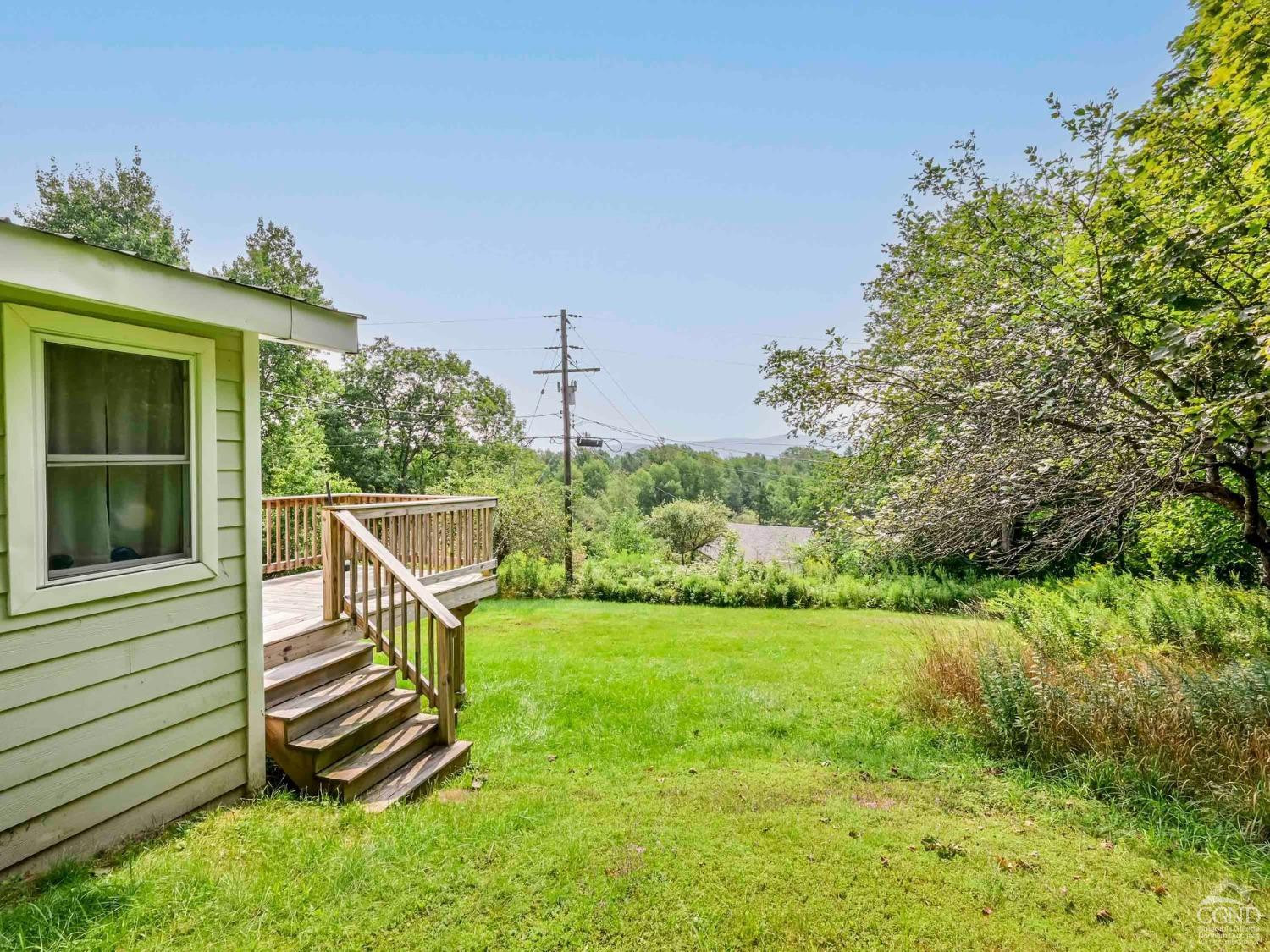 157 Horseshoe Road Conesville, NY 12076 - Photo 34 of 48 a view of a chair and table in the garden