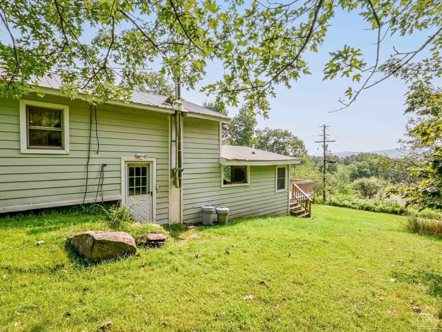 157 Horseshoe Road Conesville, NY 12076 - Photo 37 of 48 a view of a house with a yard