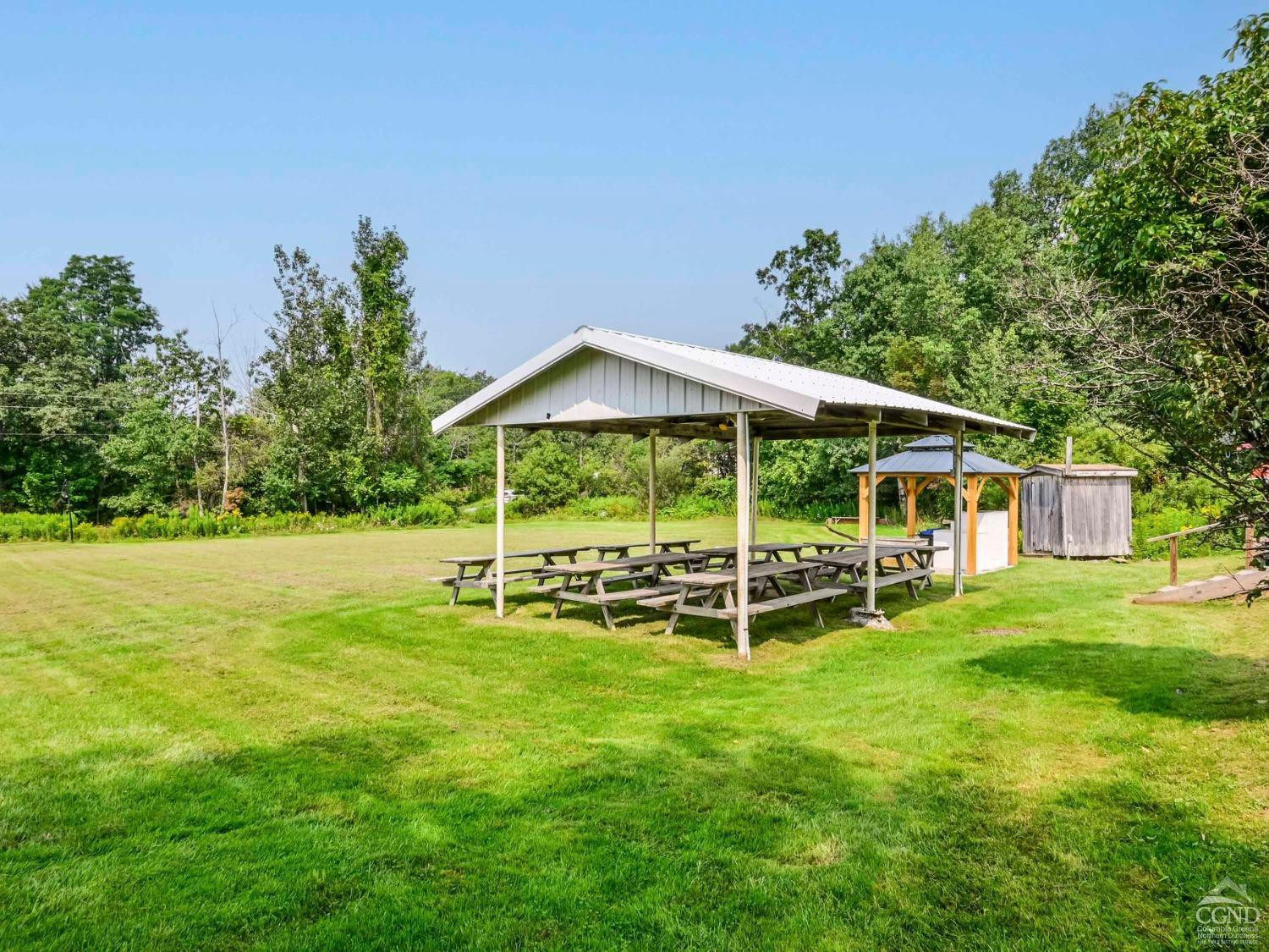 157 Horseshoe Road Conesville, NY 12076 - Photo 42 of 48 a view of a house with a backyard porch and sitting area