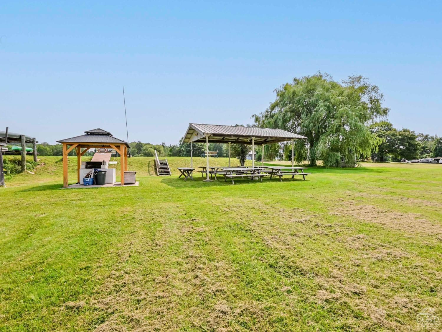 157 Horseshoe Road Conesville, NY 12076 - Photo 43 of 48 a front view of a building with a garden