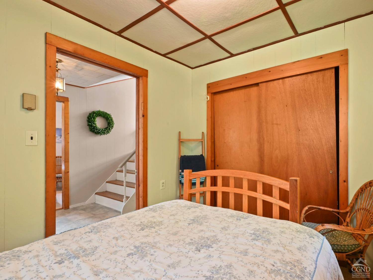 157 Horseshoe Road Conesville, NY 12076 - Photo 8 of 48 a bedroom with a bed and wooden floor