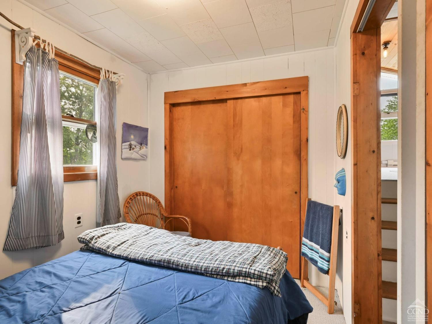 157 Horseshoe Road Conesville, NY 12076 - Photo 10 of 48 a bedroom with a bed and a window