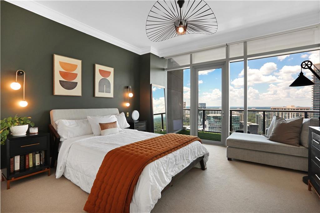 3630 Peachtree Road Northeast, Unit 2005 Atlanta, GA 30326 - Photo 11 of 32 a spacious bedroom with a bed couch and a large window