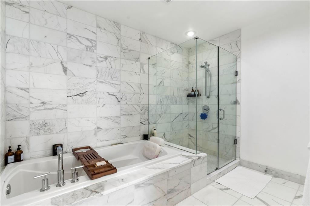 3630 Peachtree Road Northeast, Unit 2005 Atlanta, GA 30326 - Photo 13 of 32 a bathroom with a sink and a tub