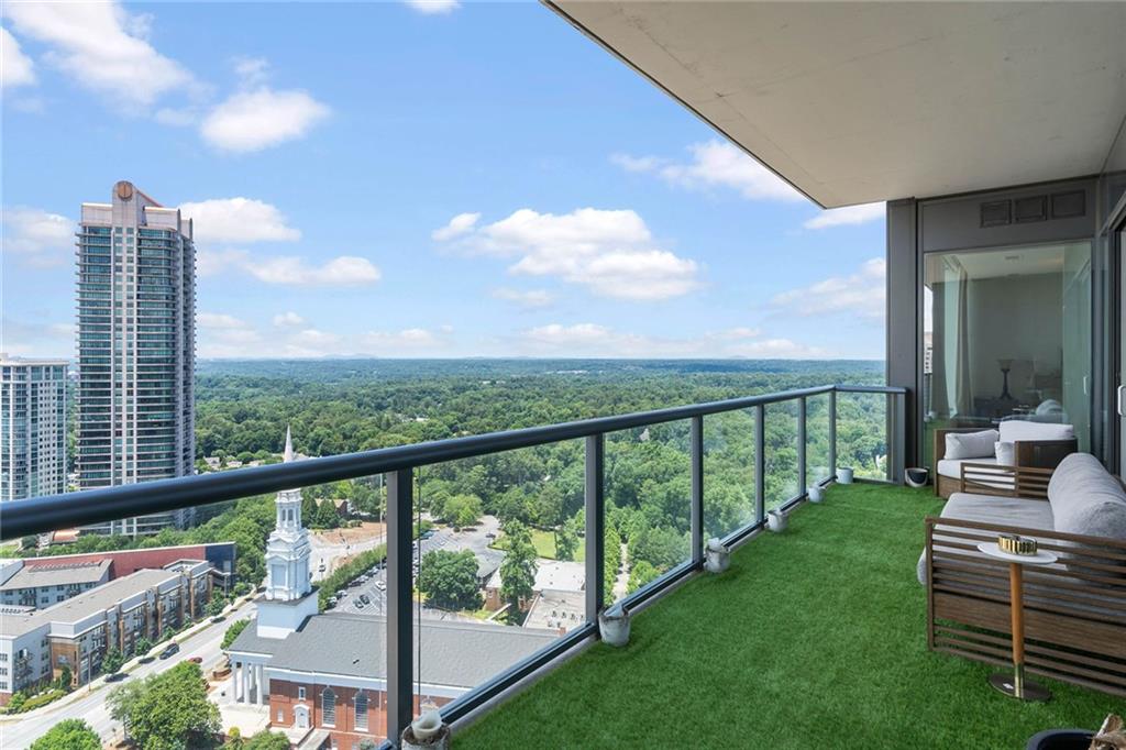 3630 Peachtree Road Northeast, Unit 2005 Atlanta, GA 30326 - Photo 17 of 32 a view of a city from a balcony with outdoor space