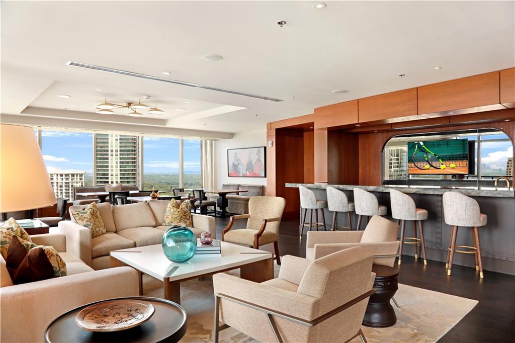 3630 Peachtree Road Northeast, Unit 2005 Atlanta, GA 30326 - Photo 20 of 32 a living room with furniture and a large window