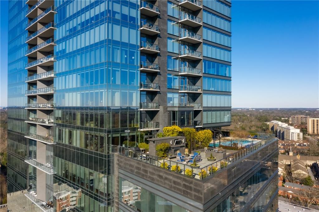 3630 Peachtree Road Northeast, Unit 2005 Atlanta, GA 30326 - Photo 26 of 32 a view of a work space with a book shelf