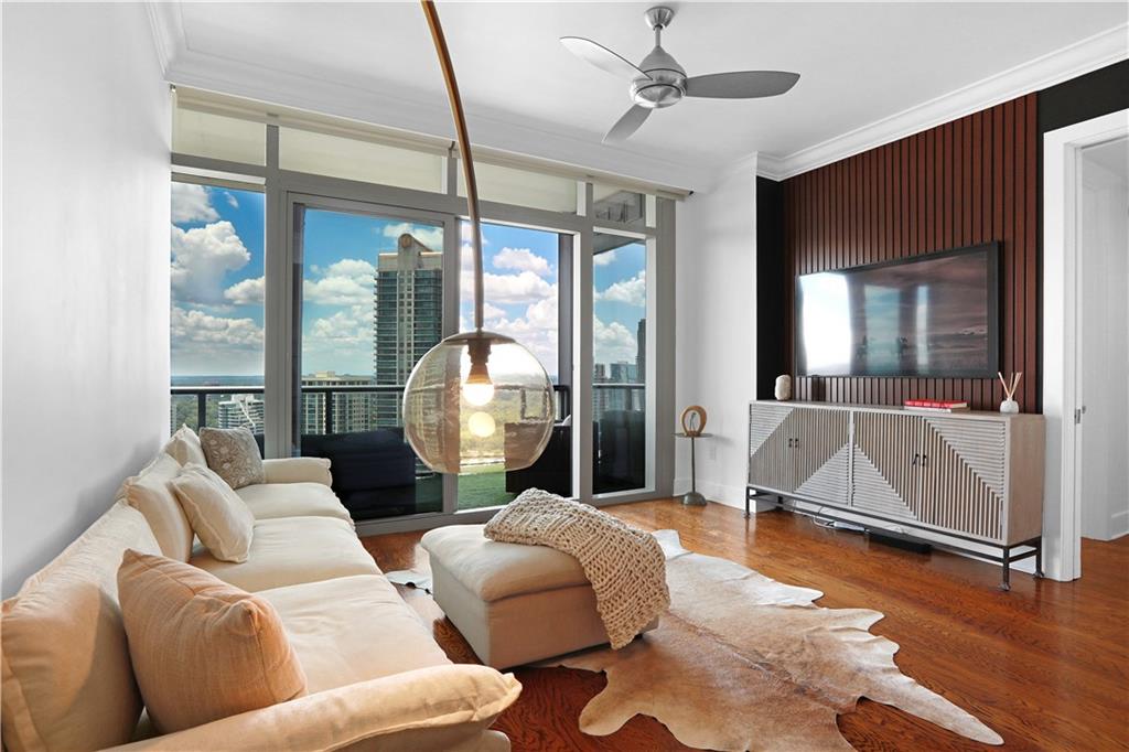 3630 Peachtree Road Northeast, Unit 2005 Atlanta, GA 30326 - Photo 4 of 32 a living room with furniture and a large window