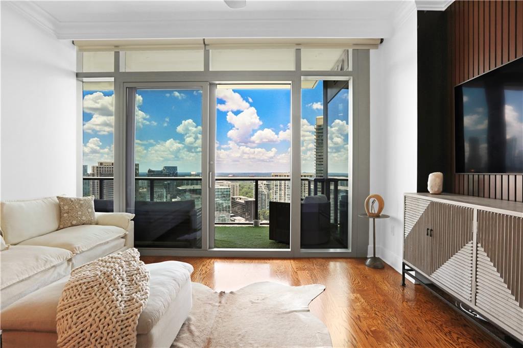 3630 Peachtree Road Northeast, Unit 2005 Atlanta, GA 30326 - Photo 5 of 32 a living room with furniture and a large window