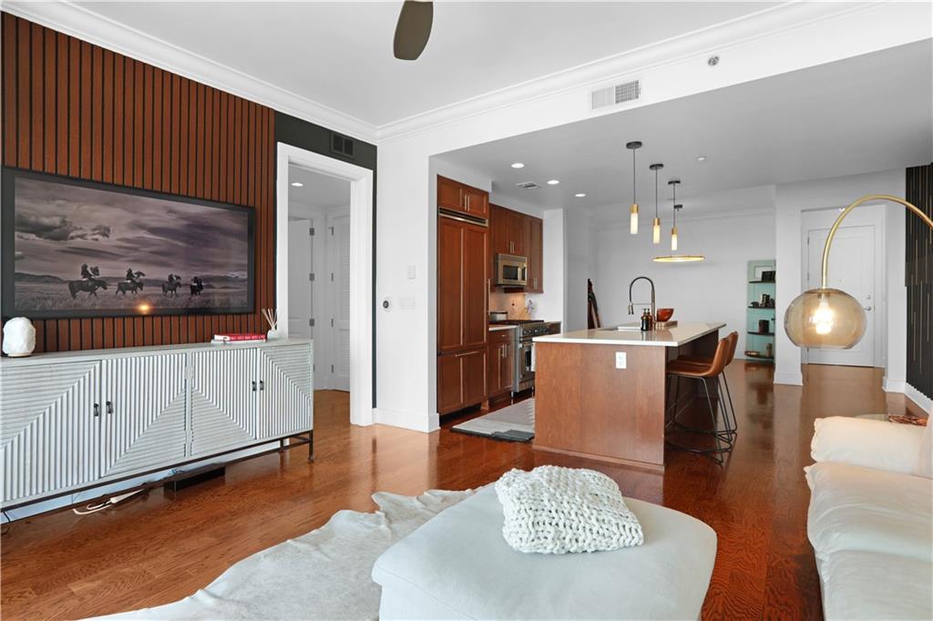 3630 Peachtree Road Northeast, Unit 2005 Atlanta, GA 30326 - Photo 7 of 32 a living room with furniture a dining table and kitchen view