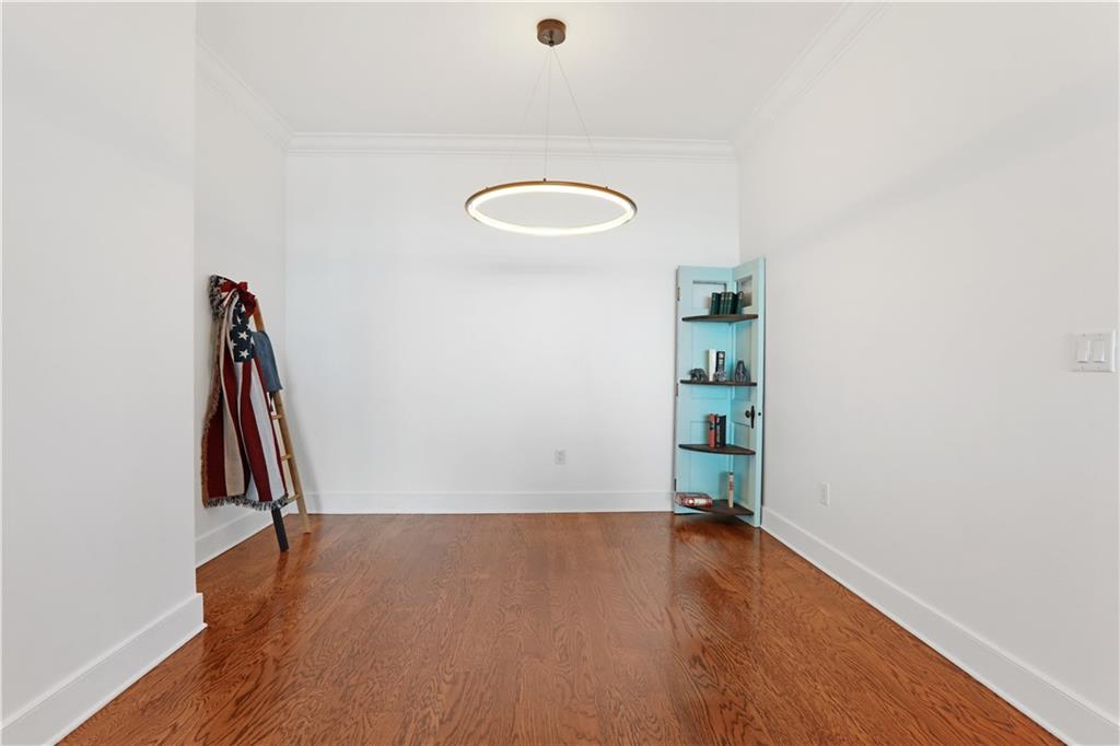 3630 Peachtree Road Northeast, Unit 2005 Atlanta, GA 30326 - Photo 10 of 32 a view of a room with wooden floor and air conditioner