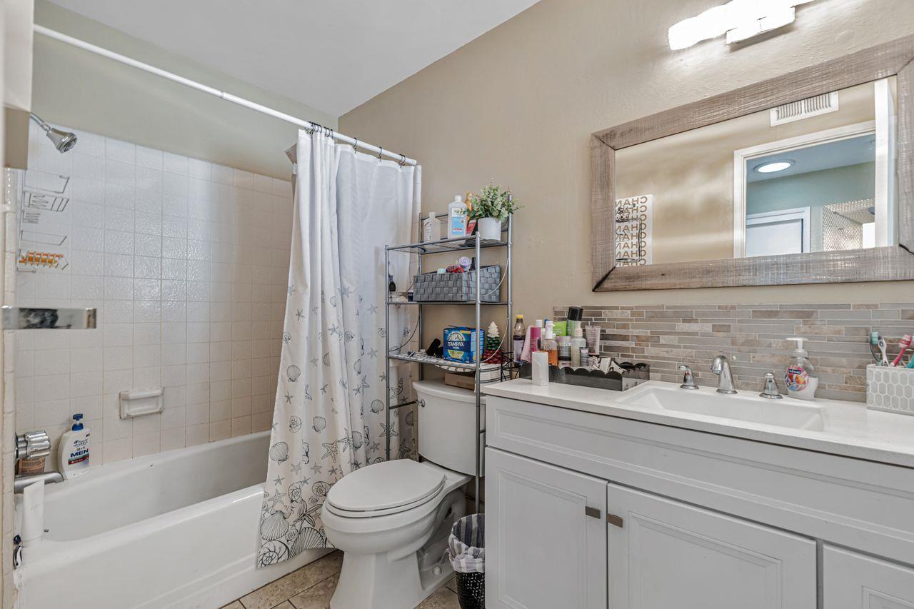 2210 San Blas Court Modesto, CA 95355 - Photo 18 of 28 a bathroom with a sink a toilet and shower