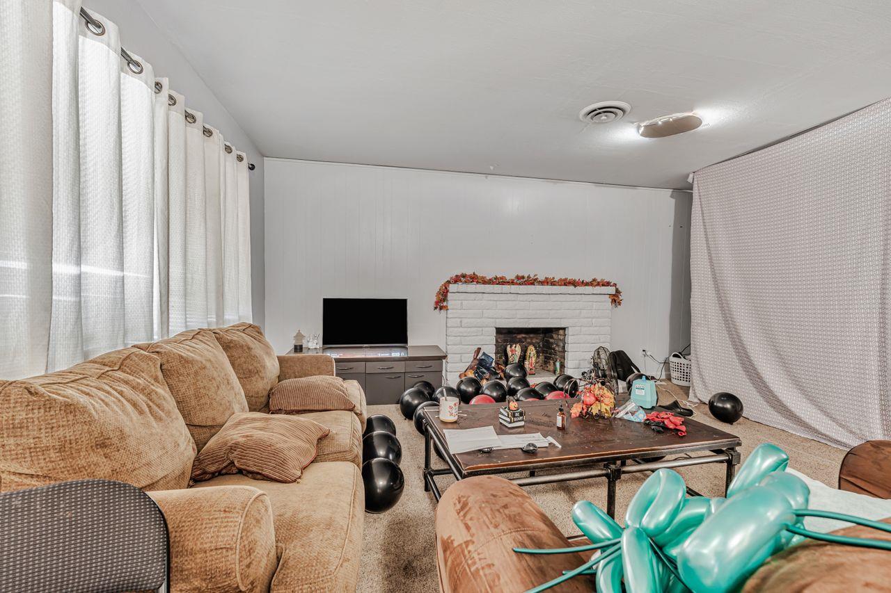 2210 San Blas Court Modesto, CA 95355 - Photo 23 of 28 a living room with furniture and a flat screen tv