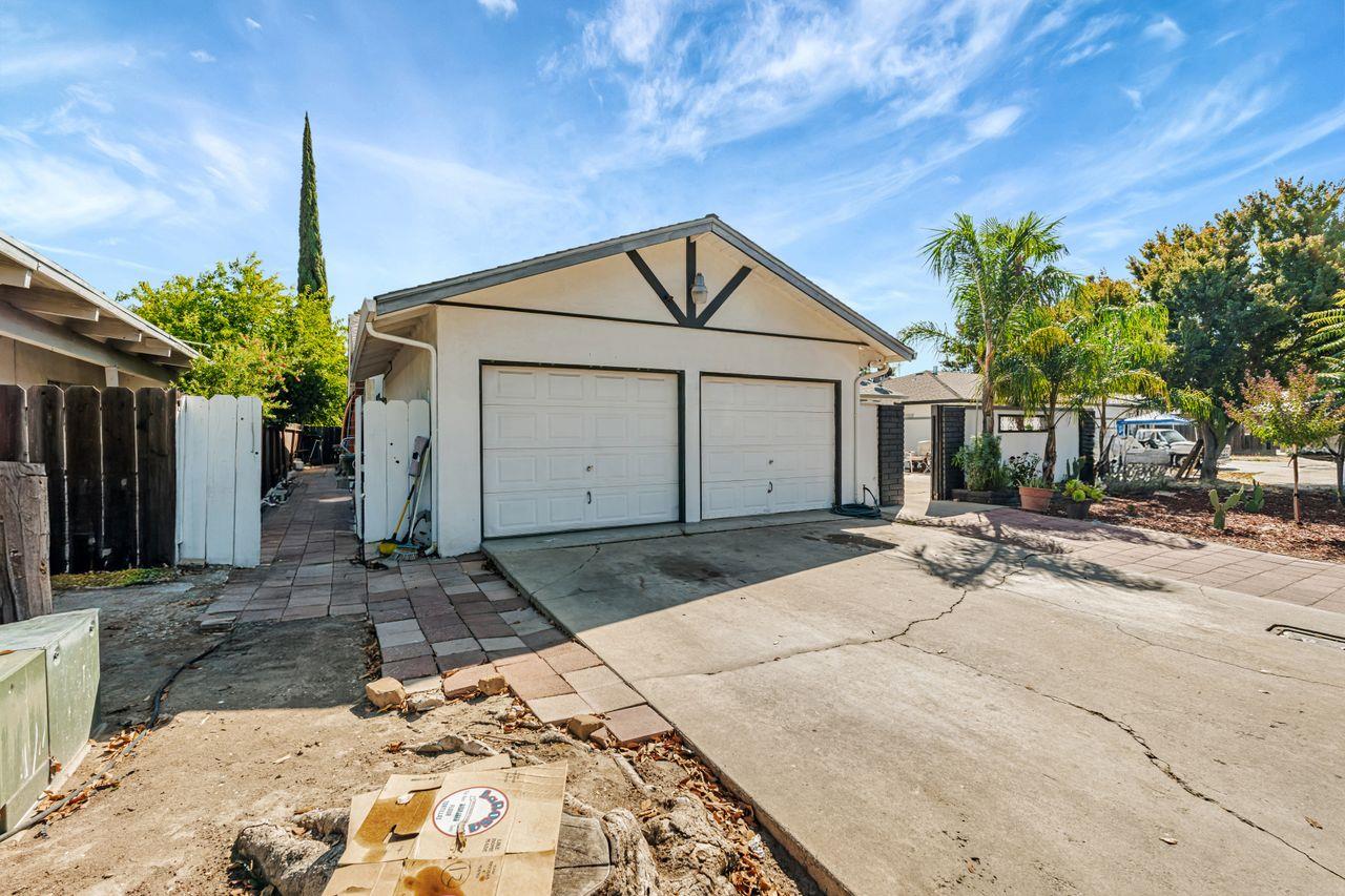 2210 San Blas Court Modesto, CA 95355 - Photo 4 of 28 a front view of a house with a yard