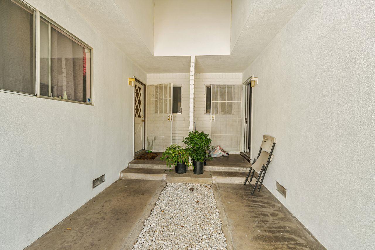 2210 San Blas Court Modesto, CA 95355 - Photo 8 of 28 a view of a hallway with wooden floor and stairs