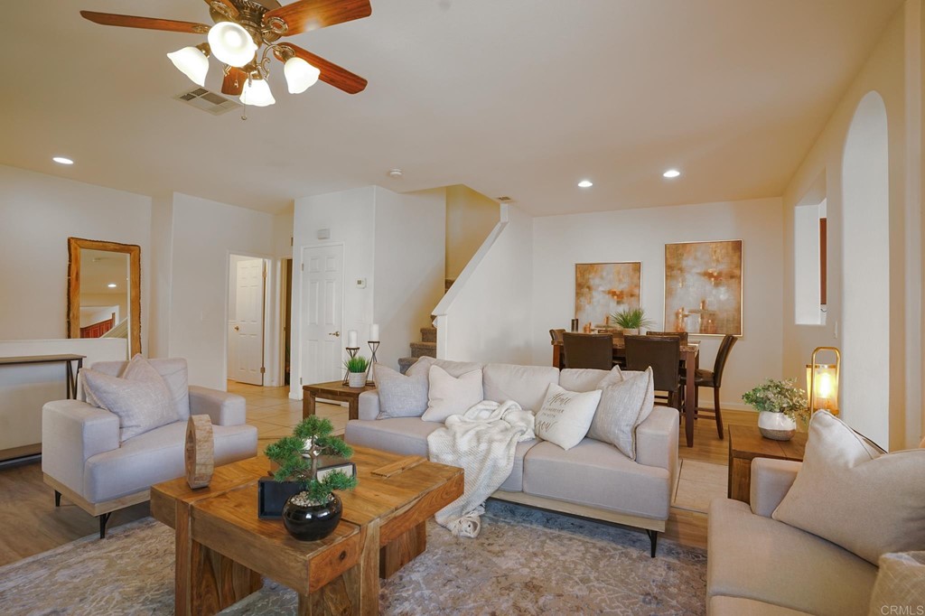 629 Sumner Way, Unit 2 Oceanside, CA 92058 - Photo 1 of 21 a living room with furniture a rug and a chandelier
