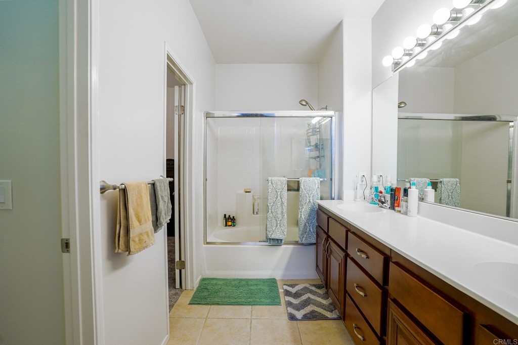 629 Sumner Way, Unit 2 Oceanside, CA 92058 - Photo 12 of 21 a bathroom with a sink and mirror