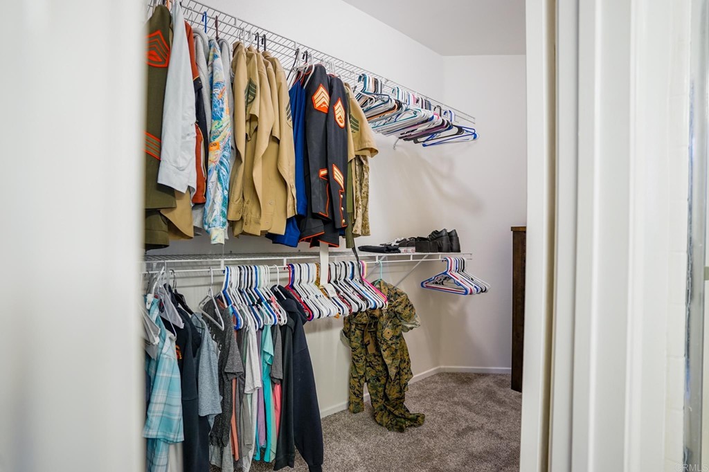 629 Sumner Way, Unit 2 Oceanside, CA 92058 - Photo 14 of 21 a view of walk in closet with clothes