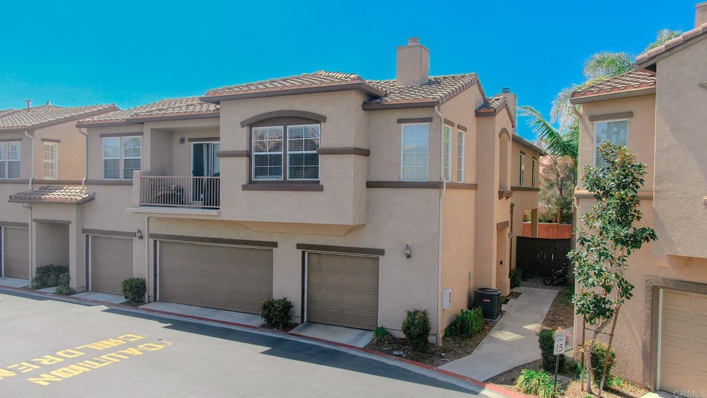 629 Sumner Way, Unit 2 Oceanside, CA 92058 - Photo 2 of 21 a front view of a house with plants