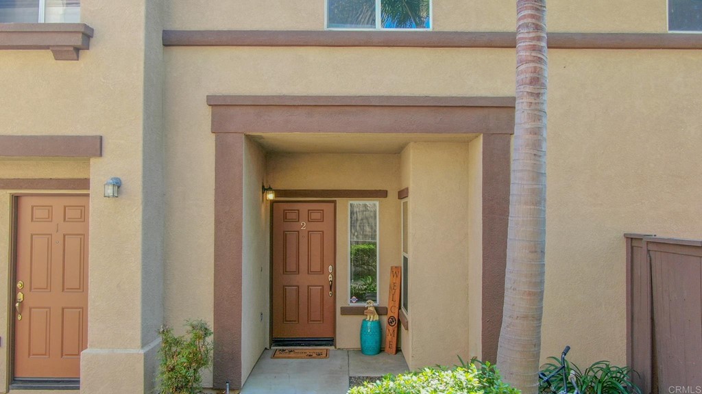 629 Sumner Way, Unit 2 Oceanside, CA 92058 - Photo 4 of 21 a view of a hallway with wooden door