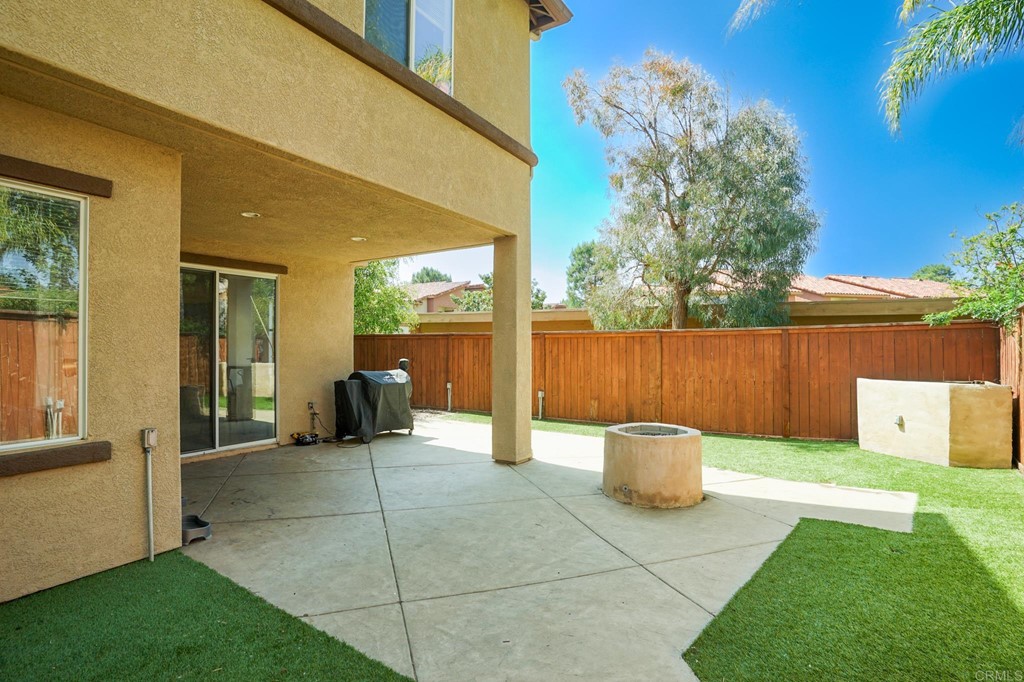 629 Sumner Way, Unit 2 Oceanside, CA 92058 - Photo 7 of 21 a view of a chair and table in backyard of the house