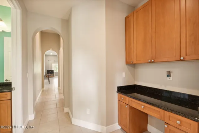 a view of a kitchen cabinets and a stove top oven