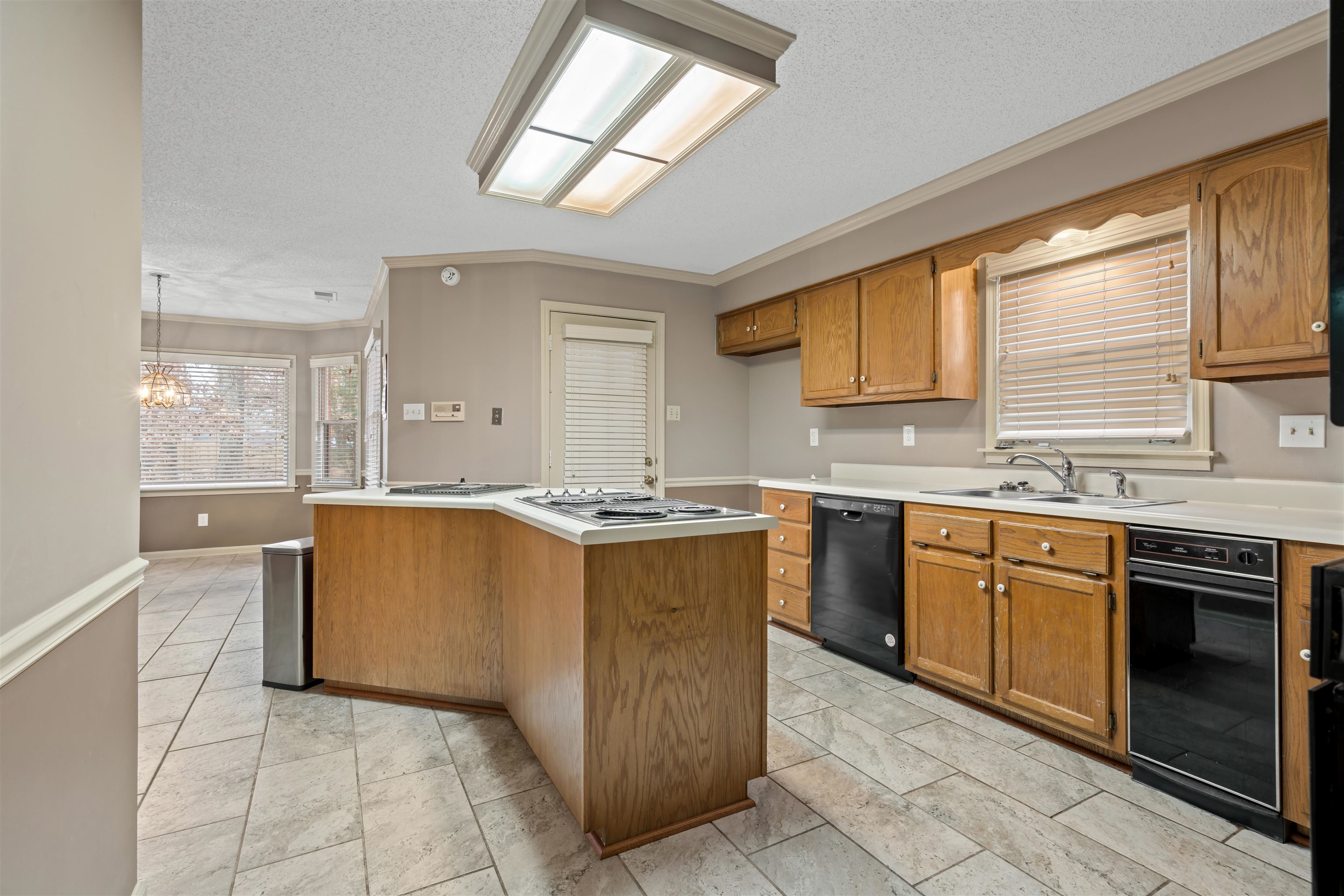 9403 Shadow Ridge Cove Cordova, TN 38016 - Photo 5 of 21 a large kitchen with stainless steel appliances granite countertop a stove sink and cabinets
