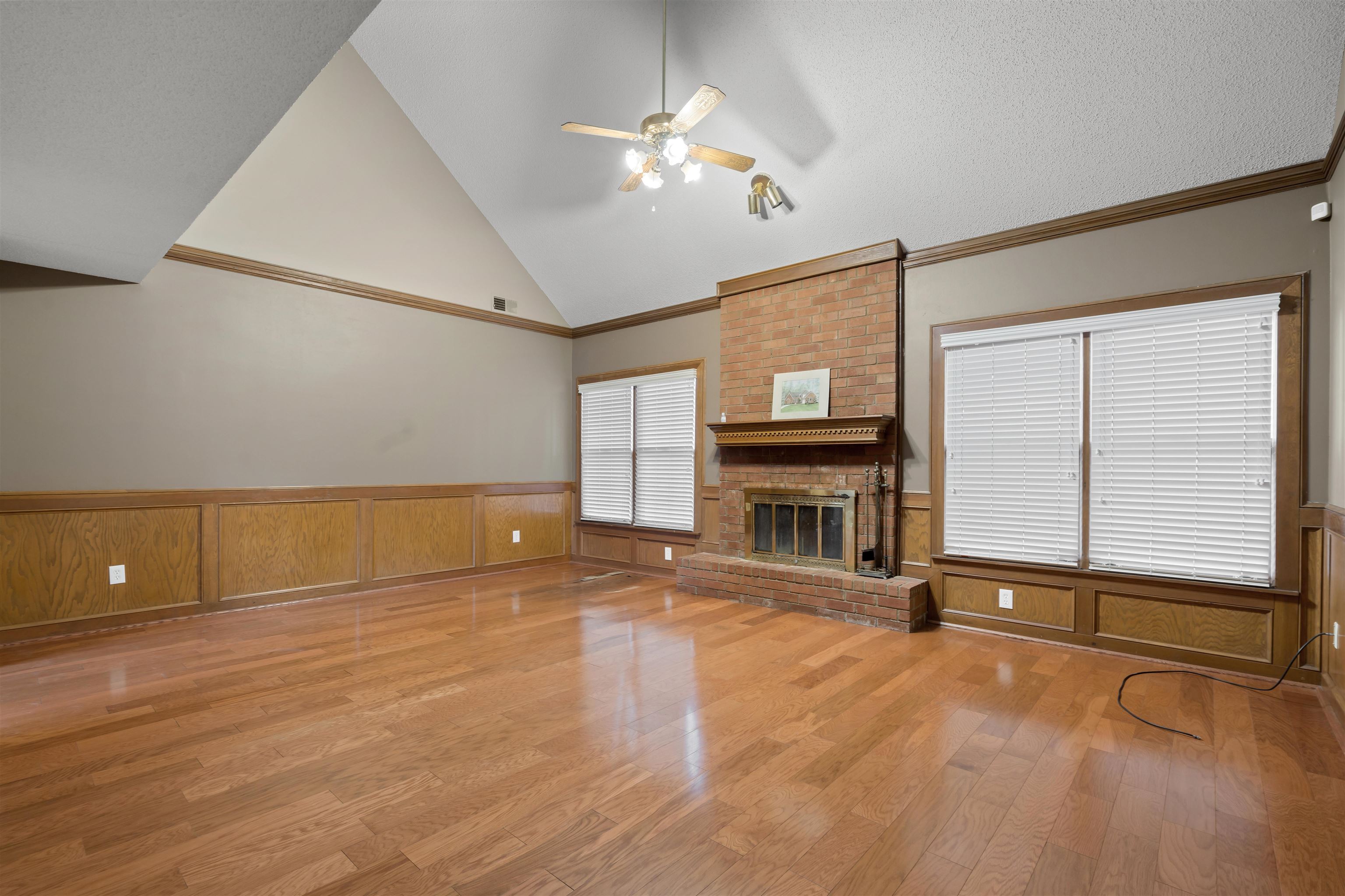 9403 Shadow Ridge Cove Cordova, TN 38016 - Photo 7 of 21 a view of an empty room with a fireplace and a window