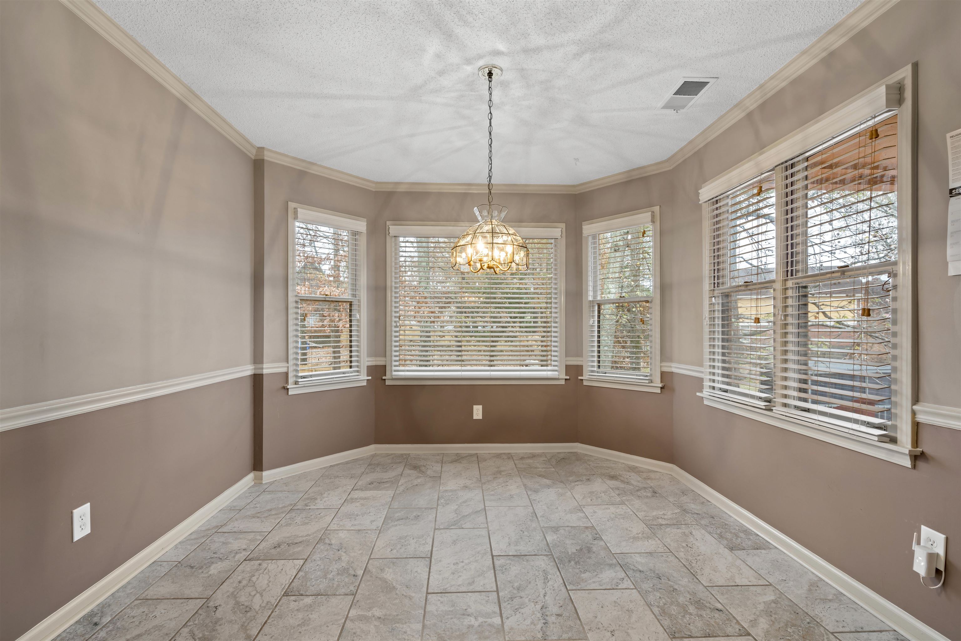 9403 Shadow Ridge Cove Cordova, TN 38016 - Photo 8 of 21 a view of an empty room with a window