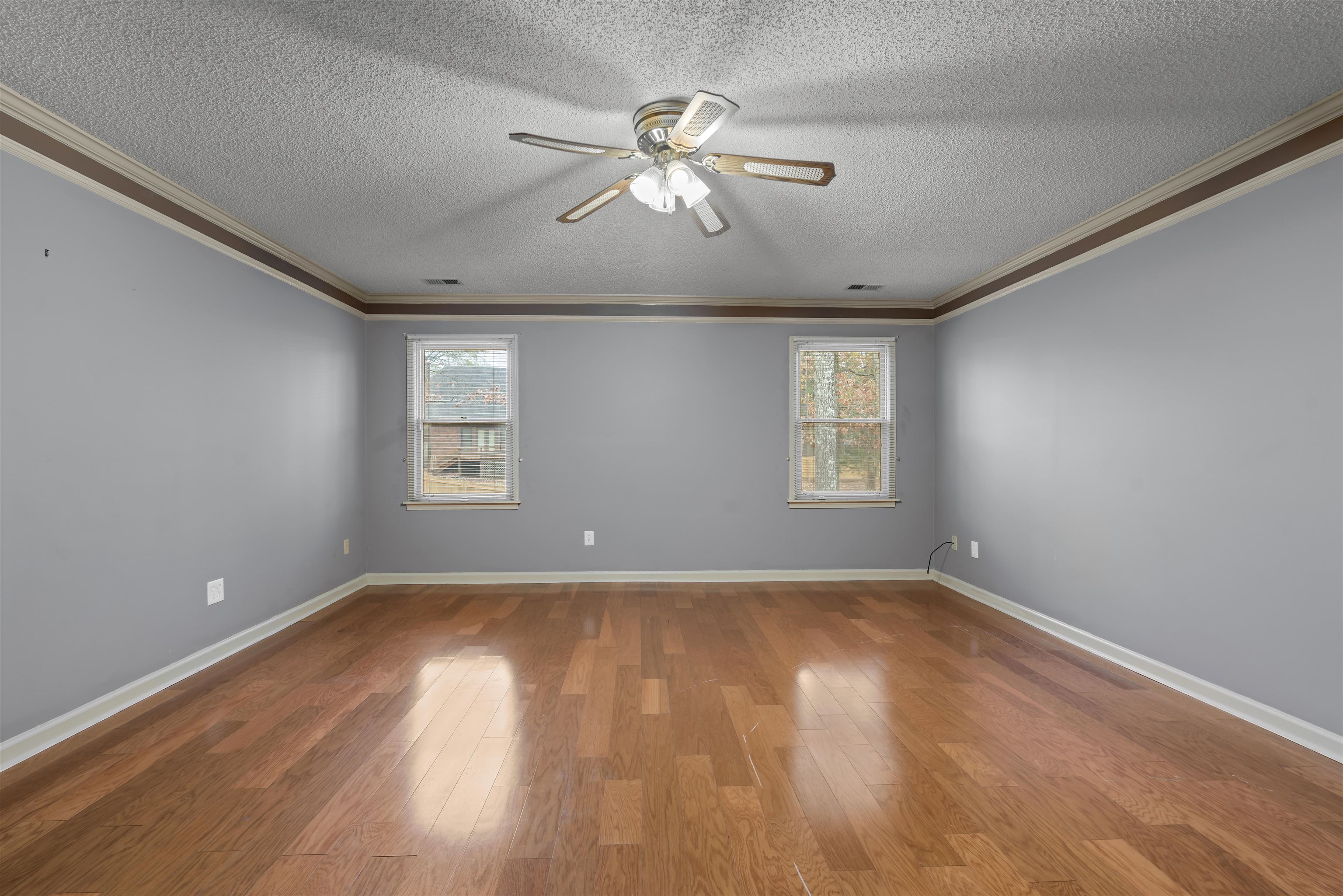 9403 Shadow Ridge Cove Cordova, TN 38016 - Photo 10 of 21 a view of an empty room with wooden floor and a window