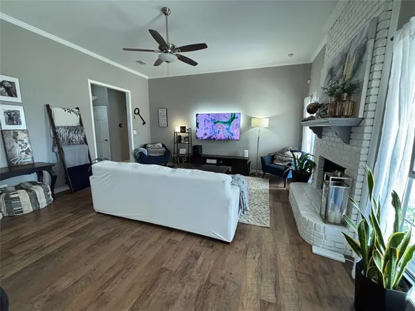 a living room with furniture and a flat screen tv