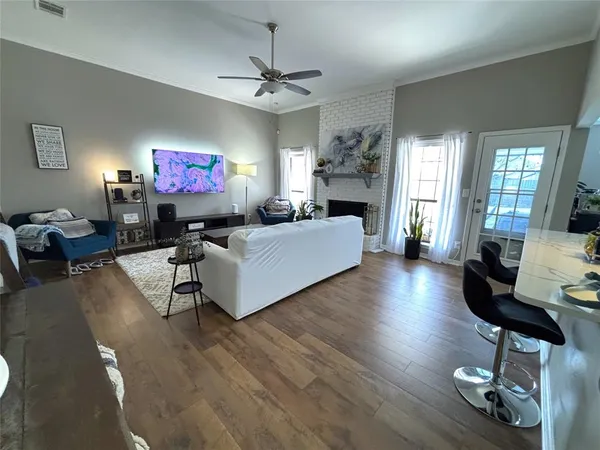a living room with furniture and a flat screen tv