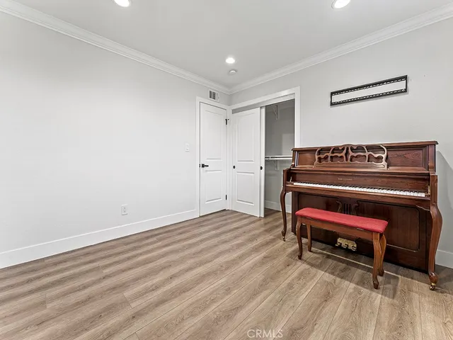 a view of workspace with wooden floor and windows