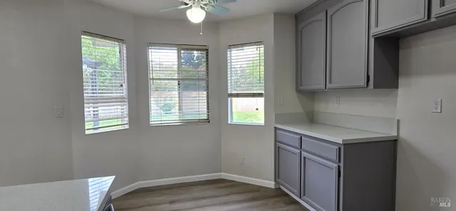 a kitchen with a cabinets and window