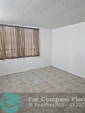 7041 Environ Boulevard, Unit 126 Lauderhill, FL 33319 - Photo 3 of 4 a view of a room with a window