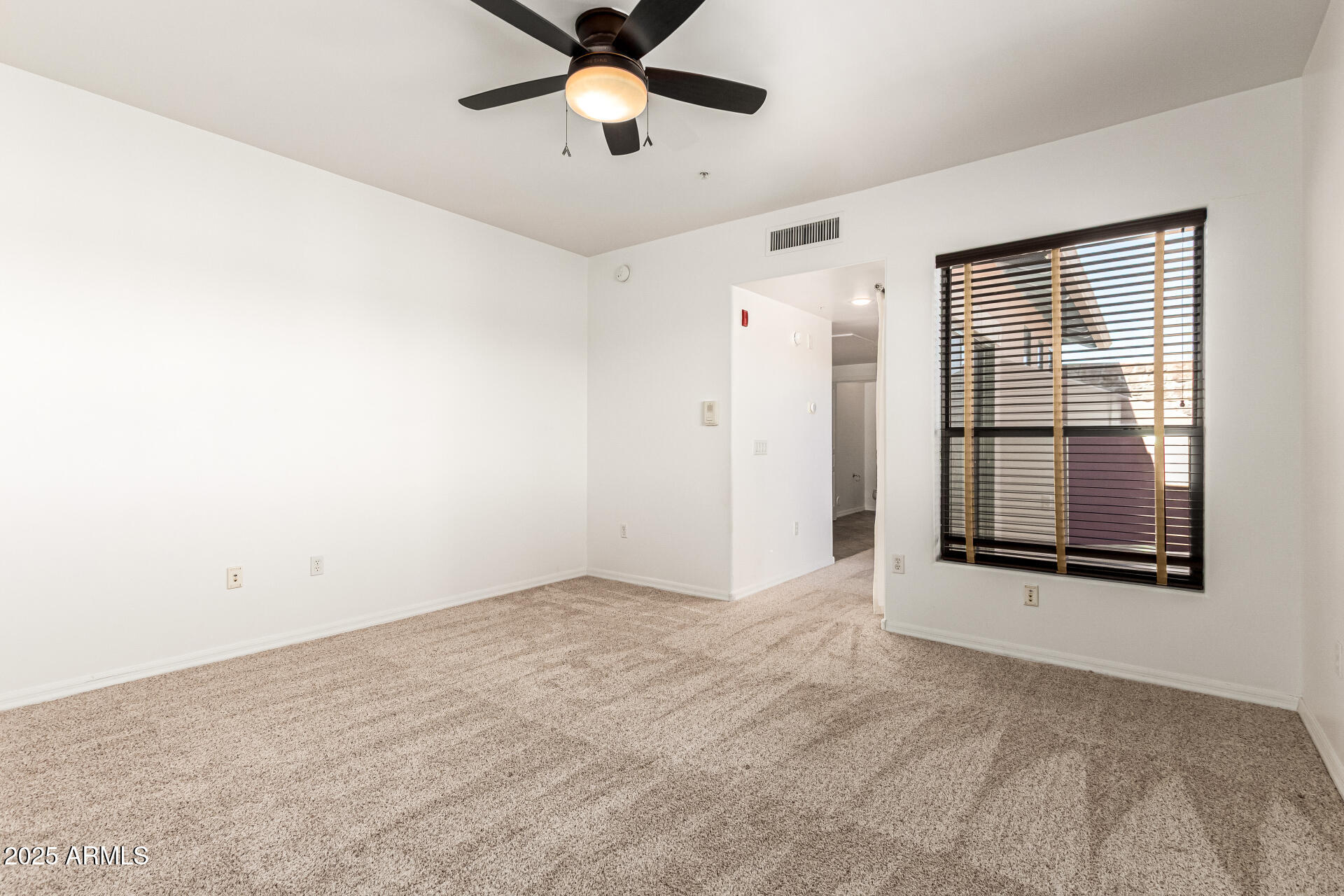 20660 North 40th Street, Unit 2120 Phoenix, AZ 85050 - Photo 11 of 39 a view of an empty room with a window