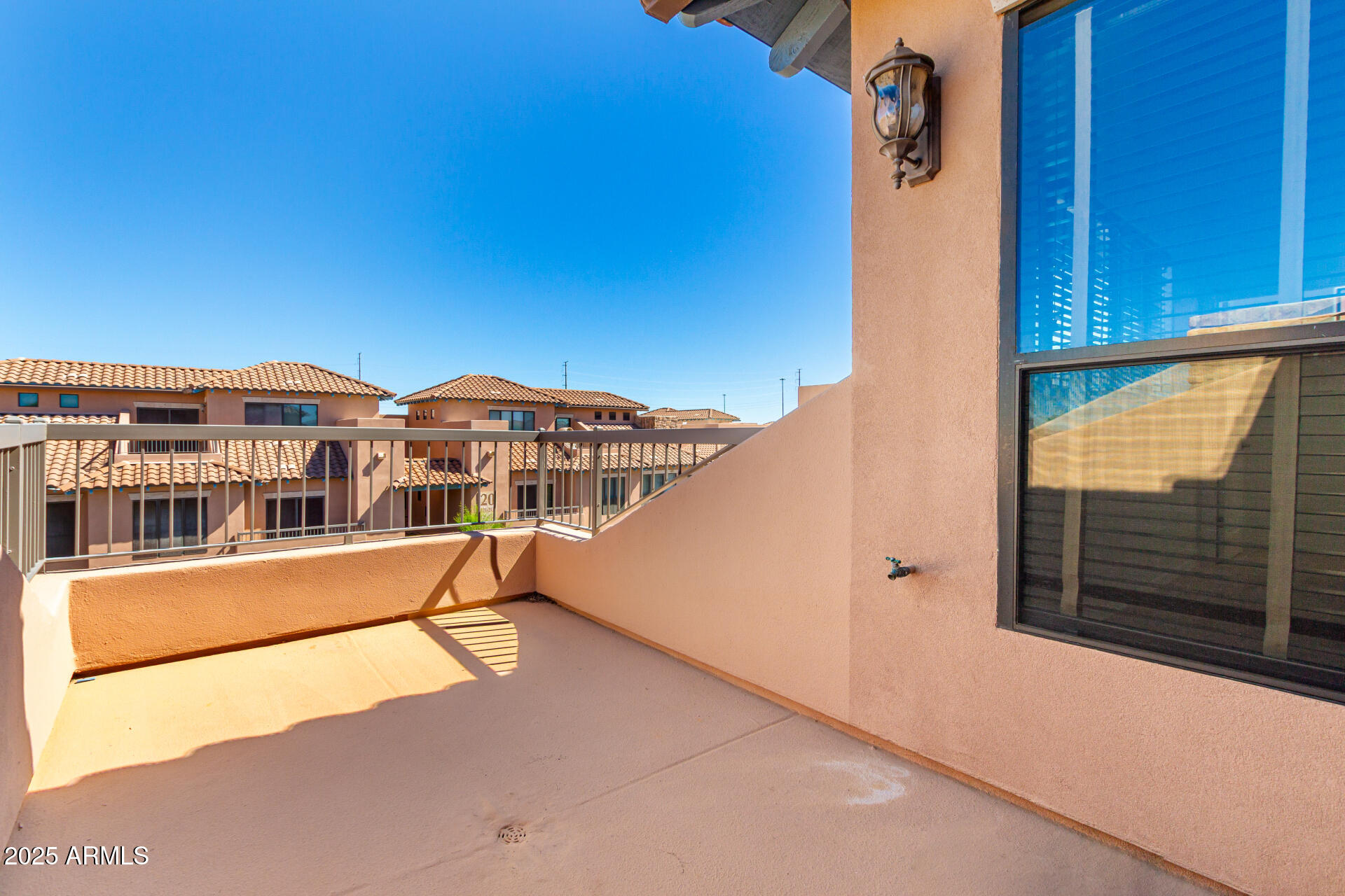 20660 North 40th Street, Unit 2120 Phoenix, AZ 85050 - Photo 24 of 39 a view of a house with a balcony