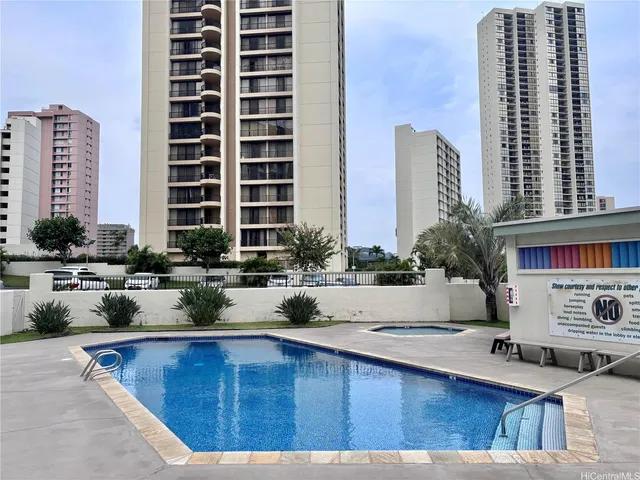 a view of a swimming pool with chairs