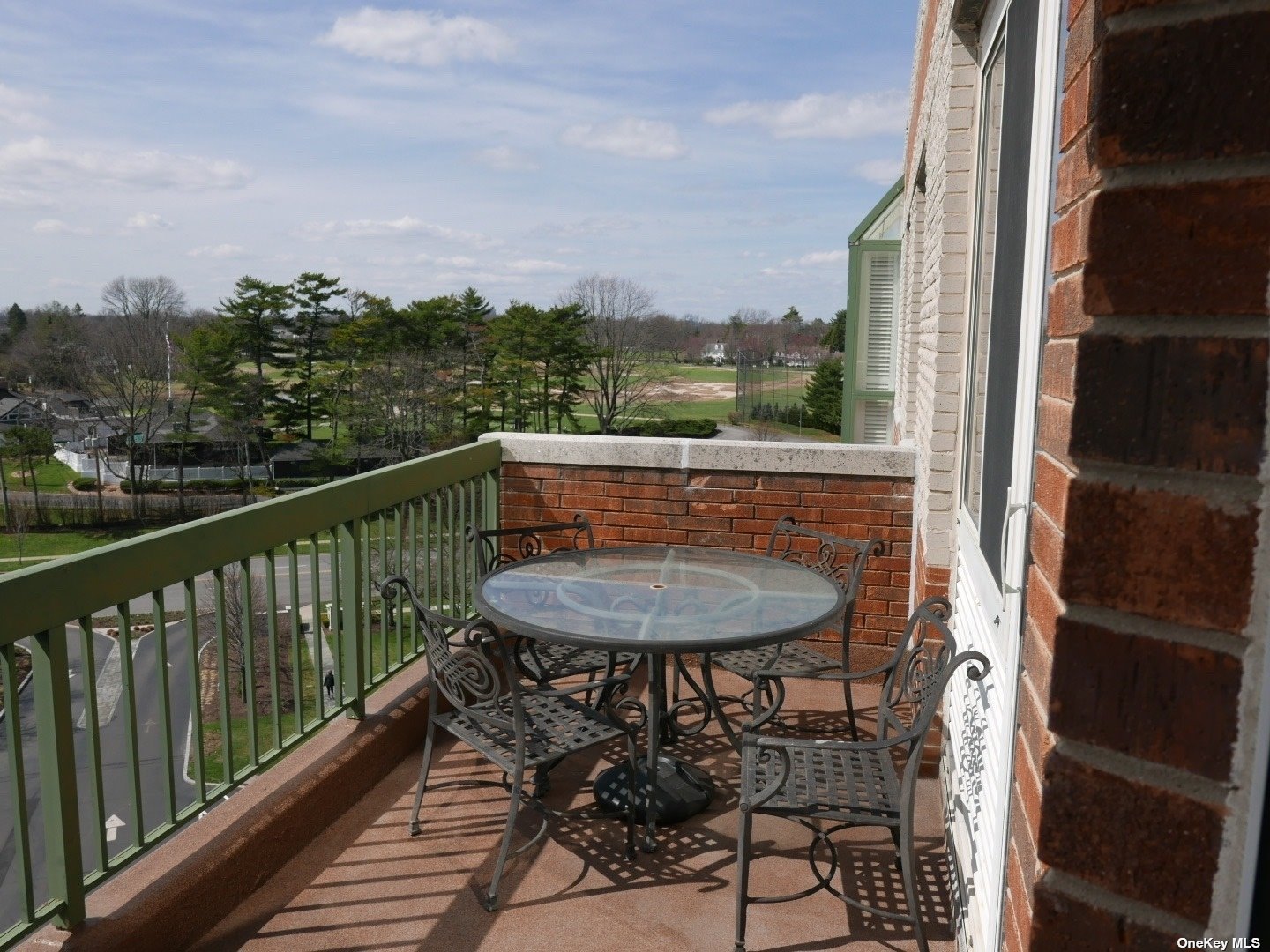 a view of a balcony with furniture
