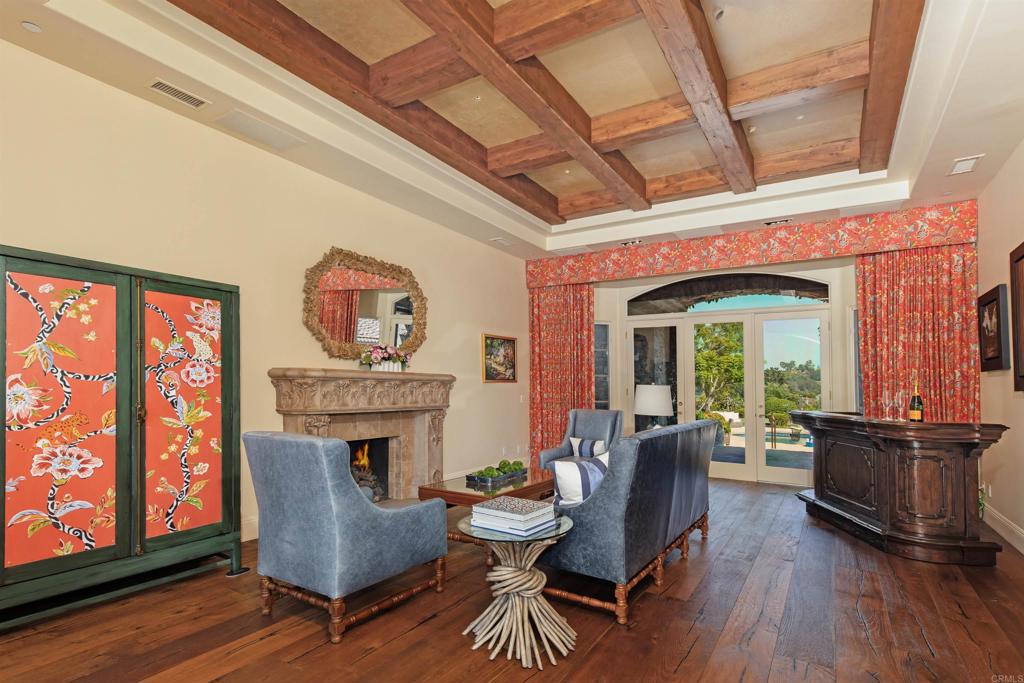 4843 La Jacaranda Rancho Santa Fe, CA 92067 - Photo 19 of 61 a living room with furniture and a fireplace