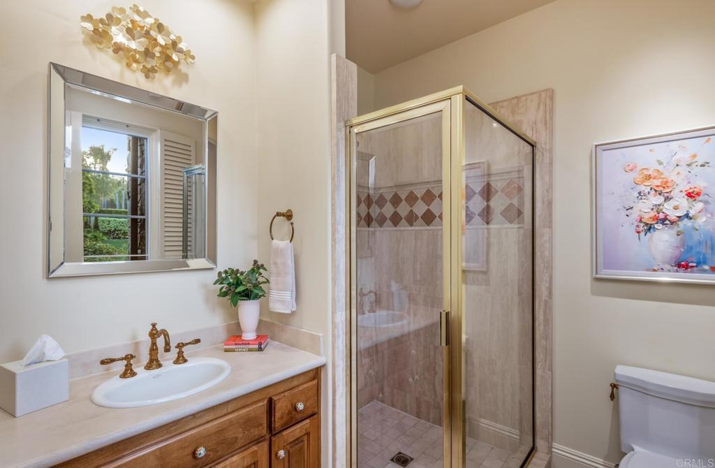 4843 La Jacaranda Rancho Santa Fe, CA 92067 - Photo 34 of 61 a bathroom with a sink vanity and a mirror