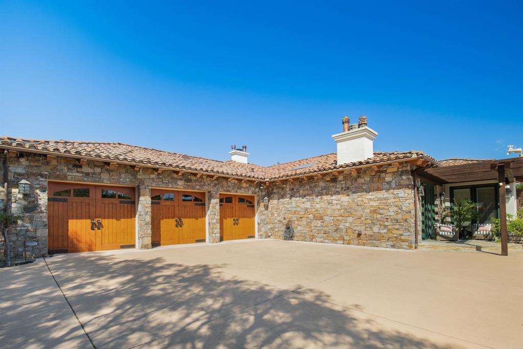4843 La Jacaranda Rancho Santa Fe, CA 92067 - Photo 38 of 61 a front view of a house with a yard
