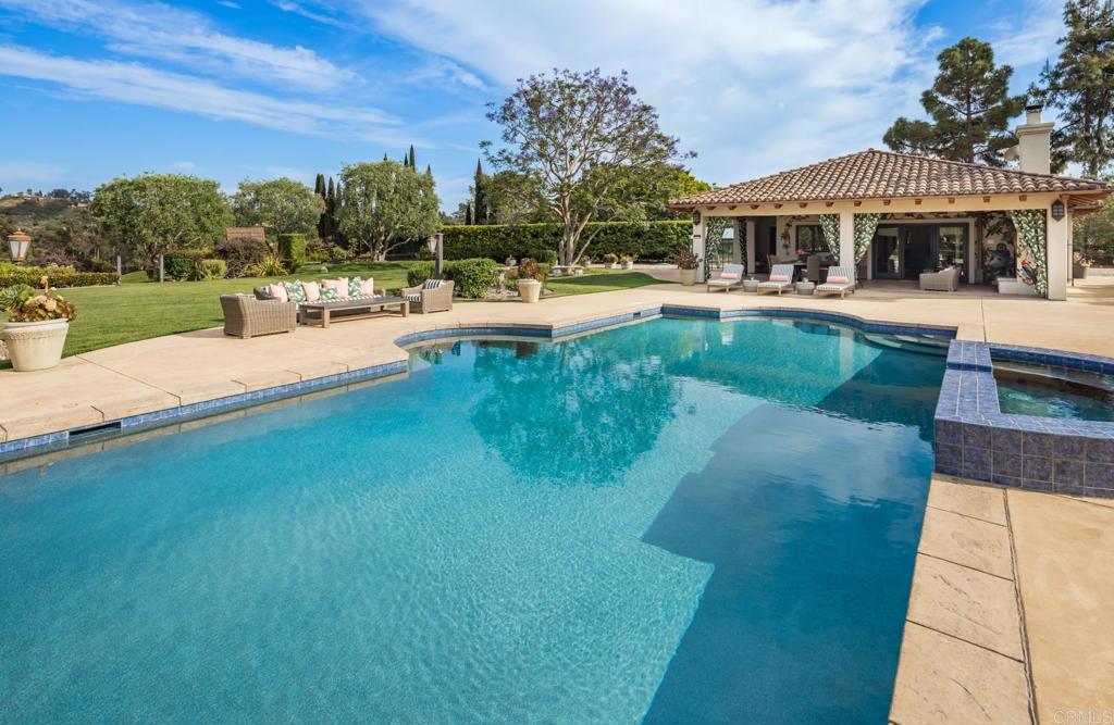 4843 La Jacaranda Rancho Santa Fe, CA 92067 - Photo 41 of 61 a swimming pool view with a seating space and a garden view