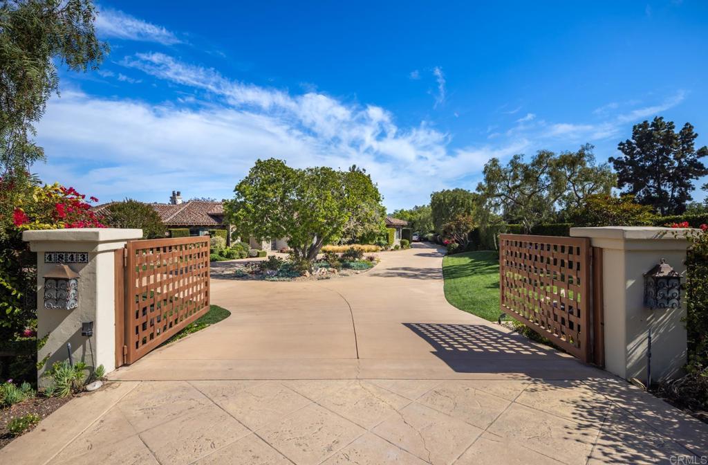 4843 La Jacaranda Rancho Santa Fe, CA 92067 - Photo 5 of 61 a view of a pathway with a wrought fence