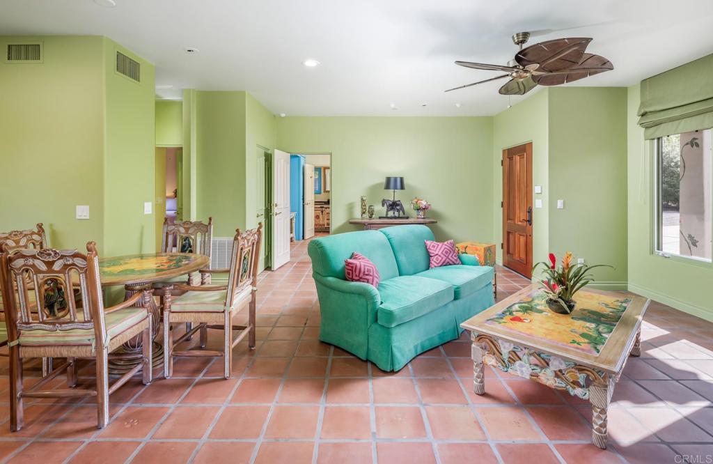 4843 La Jacaranda Rancho Santa Fe, CA 92067 - Photo 49 of 61 a living room with furniture and a chandelier