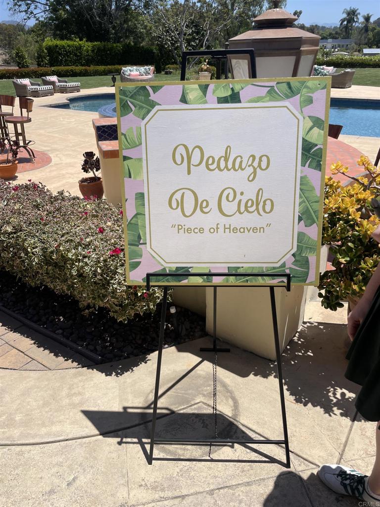 4843 La Jacaranda Rancho Santa Fe, CA 92067 - Photo 9 of 61 a sign that is sitting on a brick wall