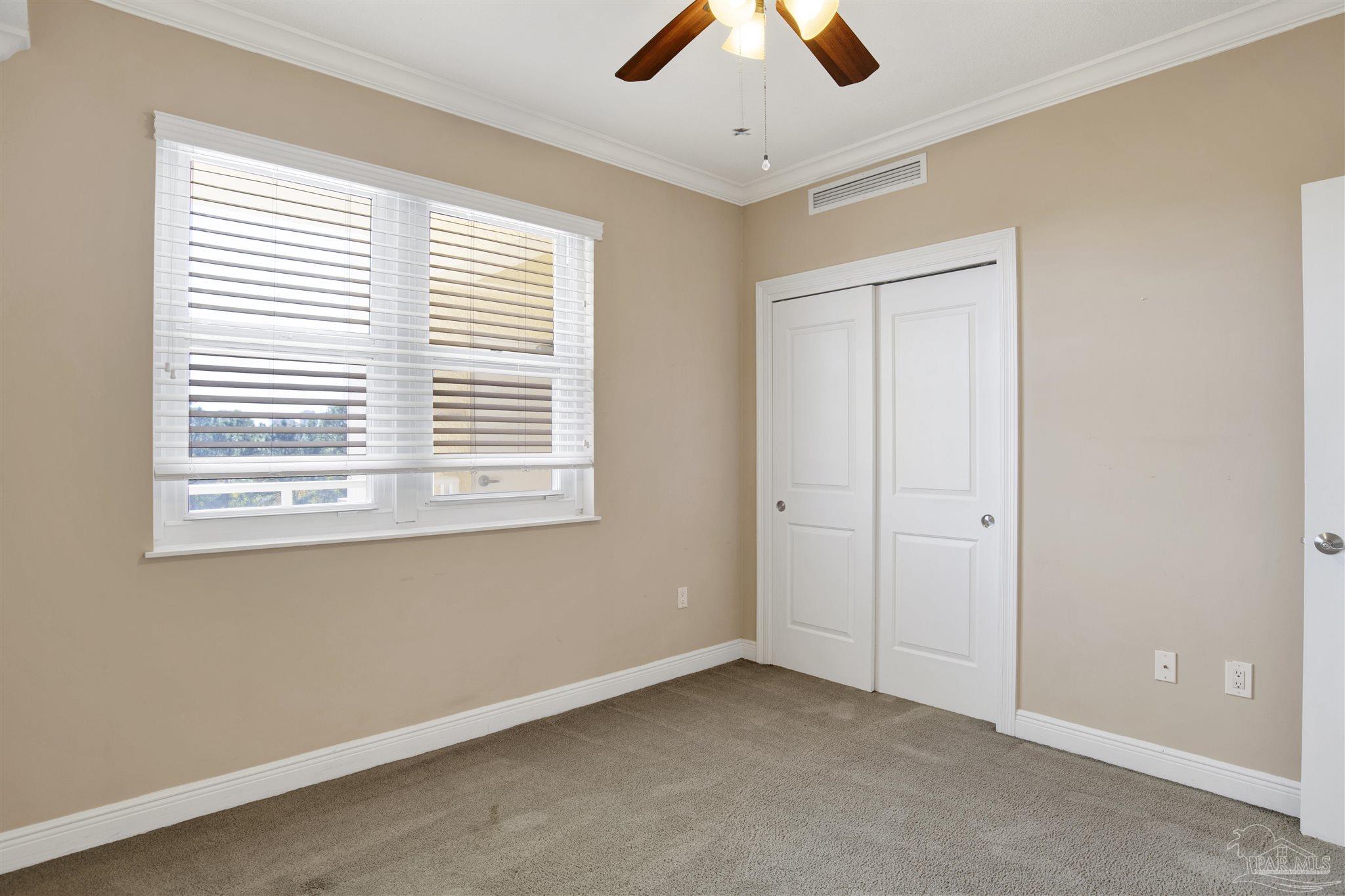 612 Lost Key Drive, Unit 401B Pensacola, FL 32507 - Photo 17 of 34 a view of an empty room with a window