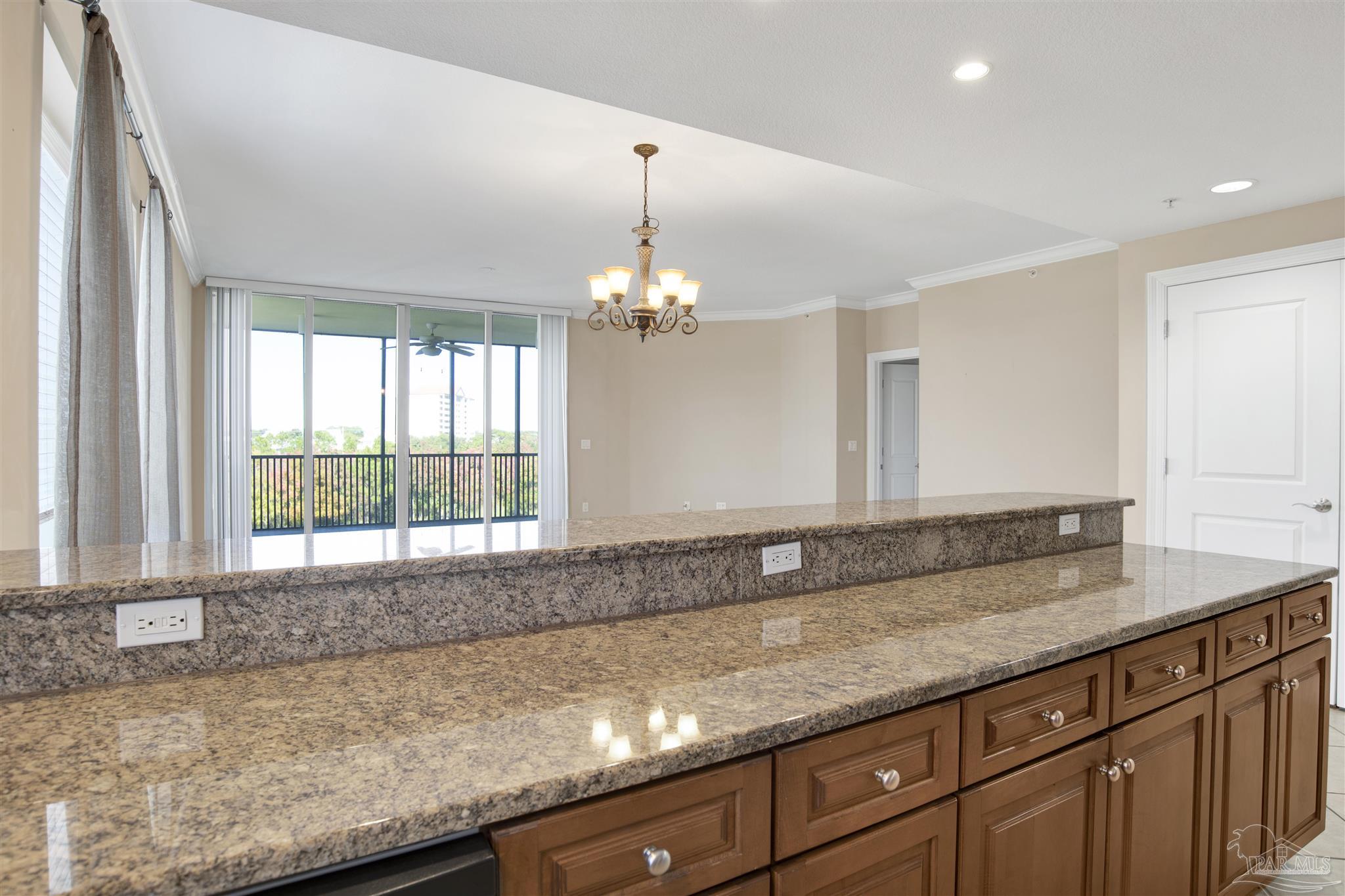 612 Lost Key Drive, Unit 401B Pensacola, FL 32507 - Photo 18 of 34 a bathroom with a granite countertop sink and large mirror
