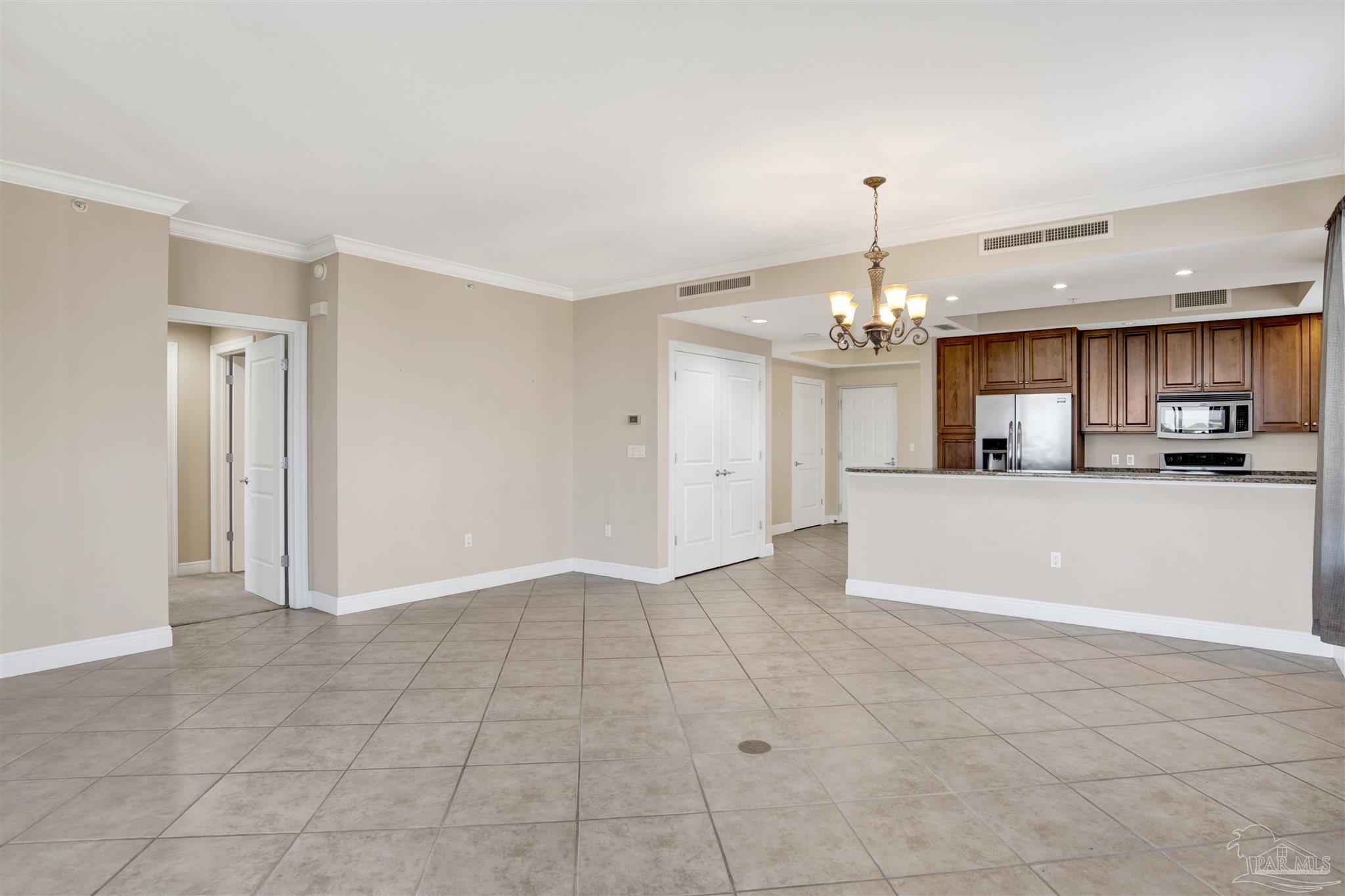 612 Lost Key Drive, Unit 401B Pensacola, FL 32507 - Photo 20 of 34 a view of a kitchen and an empty room
